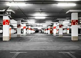 Illuminated underground car park without parked cars